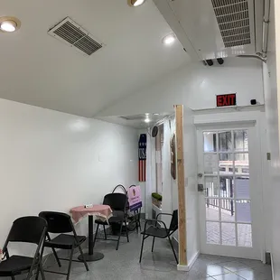 a room with a table and chairs