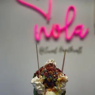 Pandan w/coconut flakes bubble waffle with Ube and Honey Dew ice cream with fruity pebbles and red velvet cake pieces - yummy beyond belief