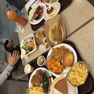 Fried chicken, Mac/cheese, sweet potato pie, roast pork, fish po boy, beet salad, Cole slaw, pork yaku mein, duck spring rolls