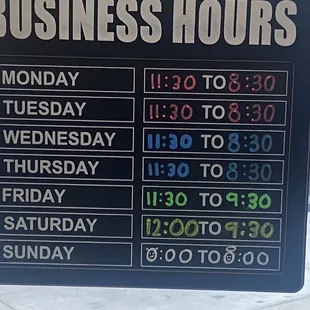 a business hours sign