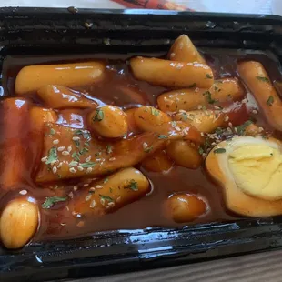 Tteokbokki comes with fish cakes + half an egg, so good.