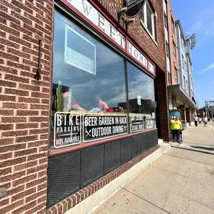 a brick building with a sign on it