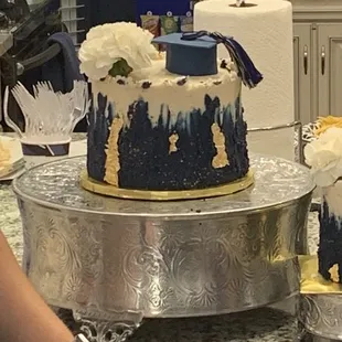 Vanilla velvet cake with buttercream frosting and. Gold handmade sugar paste decorations