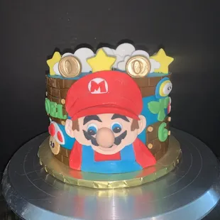 Mario brothers vanilla velvet cake with buttercream frosting and handmade sugar paste decorations