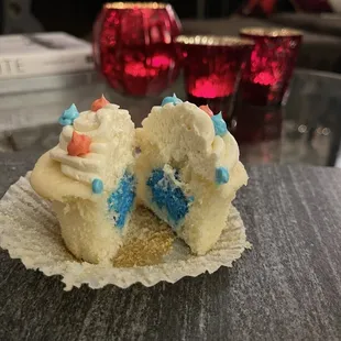 Vanilla frosting with white cake and a surprise gender reveal icing inside