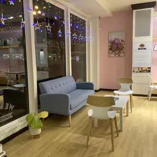 a living room with a couch and chairs
