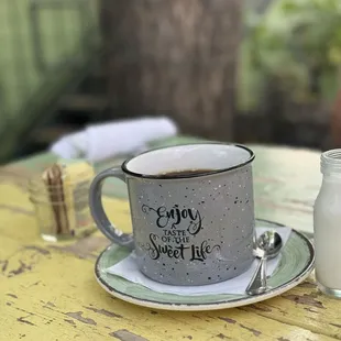 a cup of coffee on a table