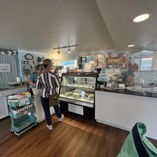 a woman standing in a bakery