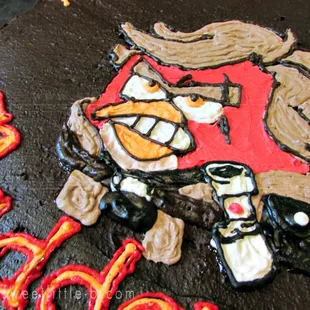 a chocolate cake decorated with a cartoon character