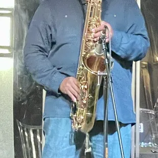 a man playing a saxophone
