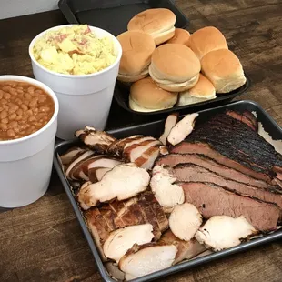 a tray of ribs, brisky, and baked beans