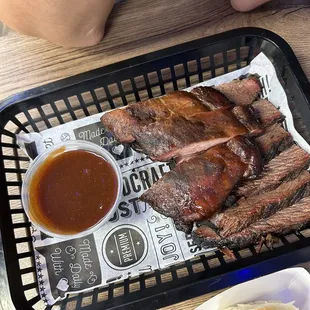 a tray of barbecued meat