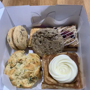 Choco chip cookie dough sandwich, s'mores bar, malted choco Oreo cookie, coffee cake, cinna roll, and rosemary sun dried tomato scone