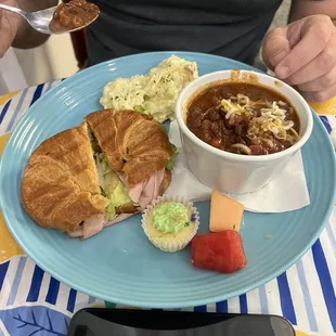 Soup and sandwich combo: chili and a grilled cheese with turkey
