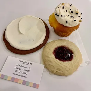 three cupcakes with frosting