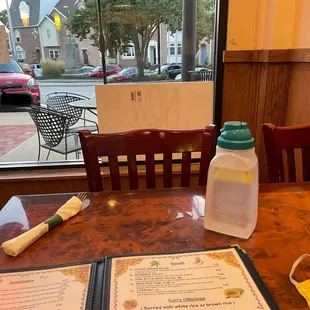 Waiting for my food after BW Band Camp with magically lemon slice water and my red Kia Soul parked outside!