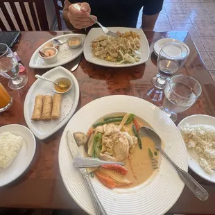 Red curry w rice and added corn  Egg rolls Stick rice  Mango fried rice  Side of shrimp