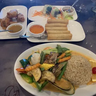 Mango Wings, Siam Rolls, Summer Rolls, Seafood Madness w/ duck side.