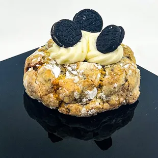 a pastry with cream and oreo cookies