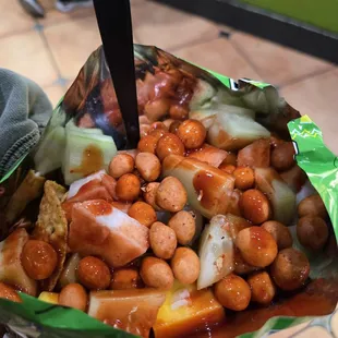 Tostilocos( japanese peanuts, cucumber, mango, tostitos, lime juice, hot sauce) without cueritos(pickled pork rinds)