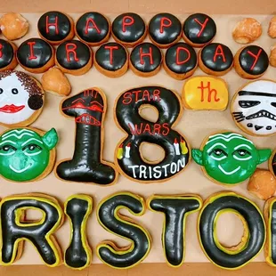 a box of decorated donuts