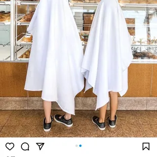 two people dressed as ghosts