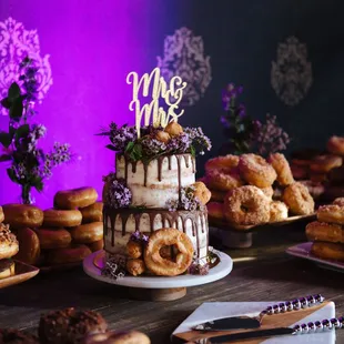 a table of doughnuts and cakes