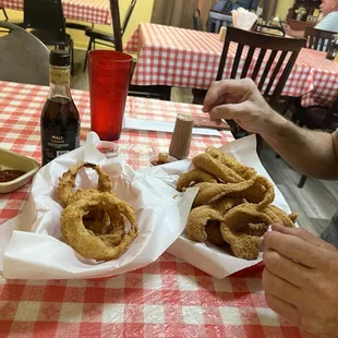 The onion rings (FRESH b/c not battered &amp; fried until you order) and the fish basket.