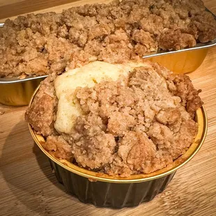 two muffins with a crumb topping
