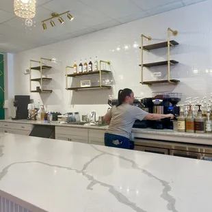 a woman sitting at a counter