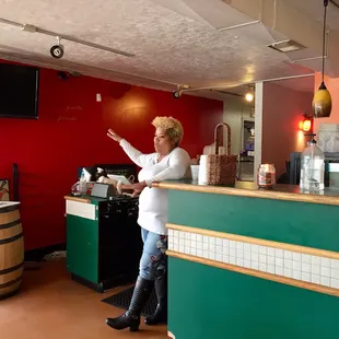 a woman standing at a counter
