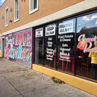 a storefront window with a sign that says sweet peaches