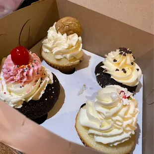 a dozen cupcakes in a box