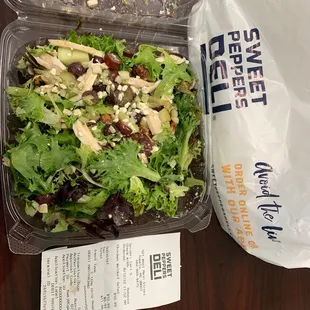 a salad in a plastic container