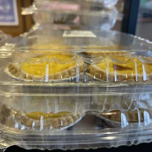 a variety of pastries in plastic containers