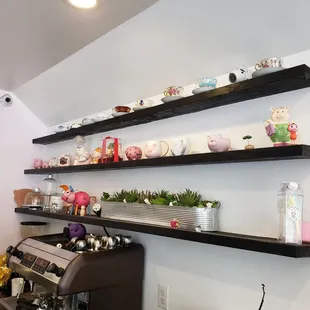 shelves with tea cups and teapots