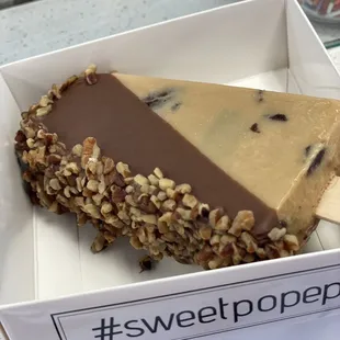 a piece of ice cream on a stick