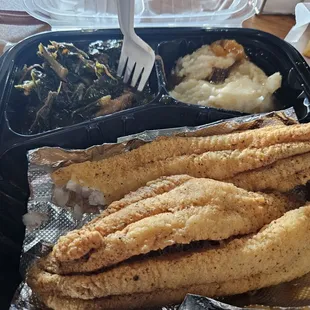 Fried fish,  mashed potatoes, and greens.