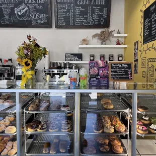Display case filled with a good variety of donuts