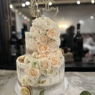 Our beautiful delicious wedding cake that was decorated with beautiful roses and delicious macaroons