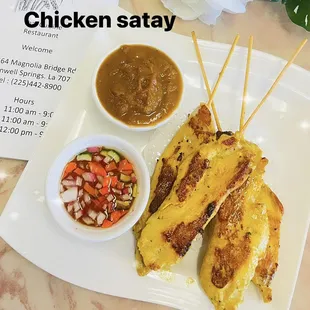chicken satay with a side of salsa