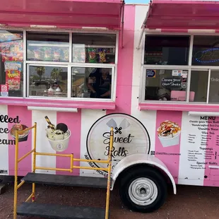 a pink and white food truck