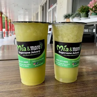 two cups of juice on a table