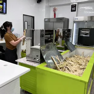 a woman in a kitchen preparing food