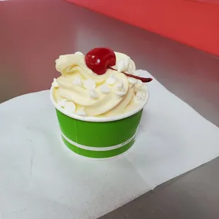 Delicious non-fat Vanilla and a little low-fat Cake Batter froyo, topped with yogurt drops and a single Maraschino cherry!