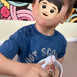 One scoop of chocolate with rainbow sprinkles