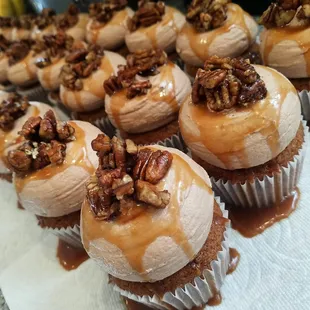 Tough Guy - carmel velvet pecan cake topped with chocolate peanut butter buttercream, a drizzle of carmel and candied pecans