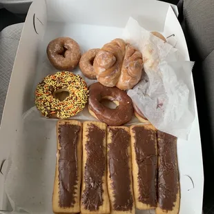 From the top, glazed cake, butterfly, sprinkle, chocolate covered yeast, and LONG JOHNS