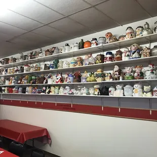 a wall full of coffee mugs