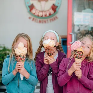 three girls eating ice cream cones